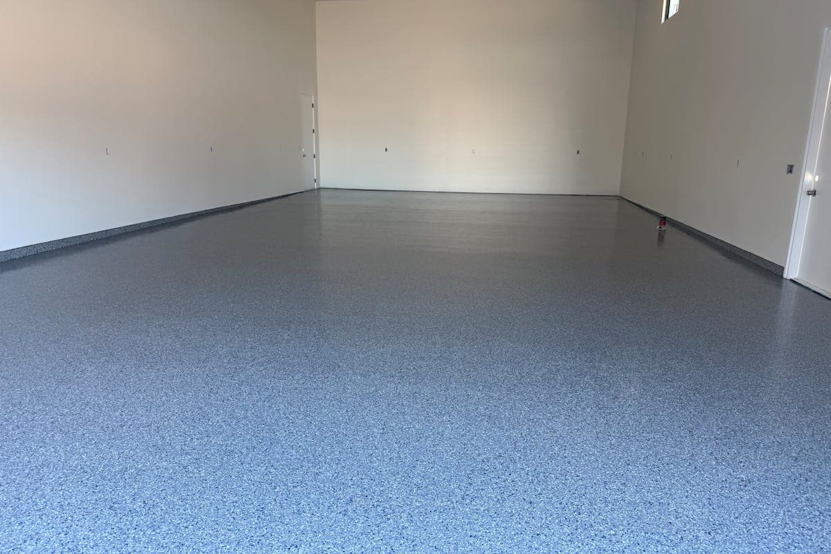 Blue-blend full-flake polyaspartic floor installed in an Arizona RV garage